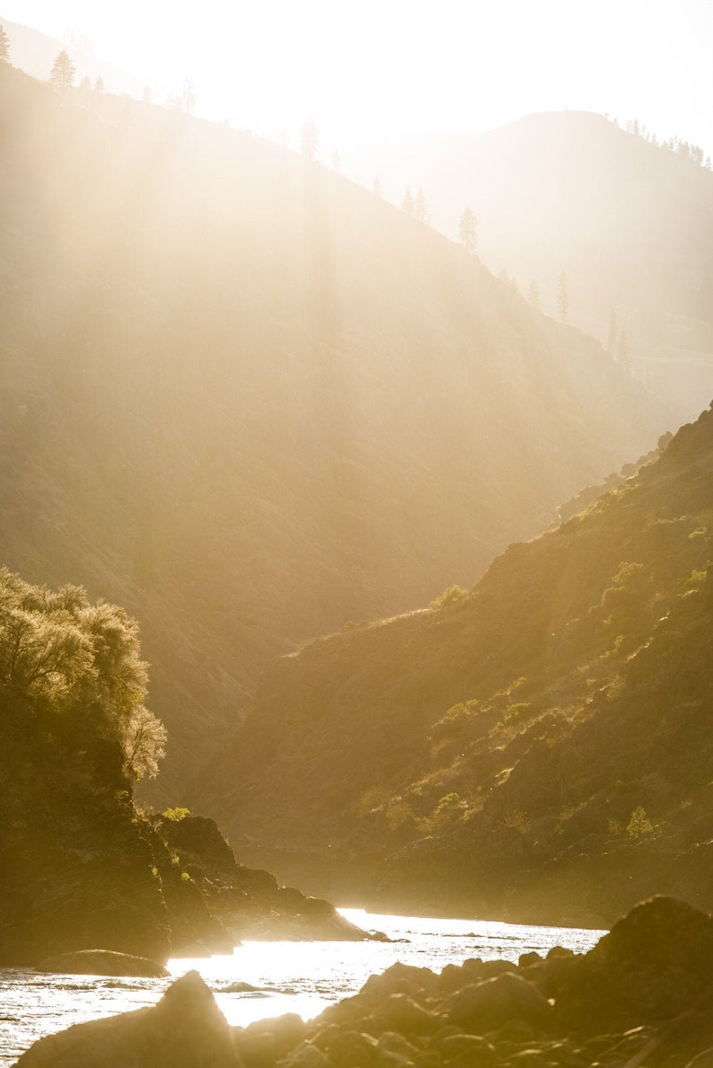 Golden Light on the Salmon River, Idaho. Headed down a never-ending river full of whitewater, friends, and cold beer.