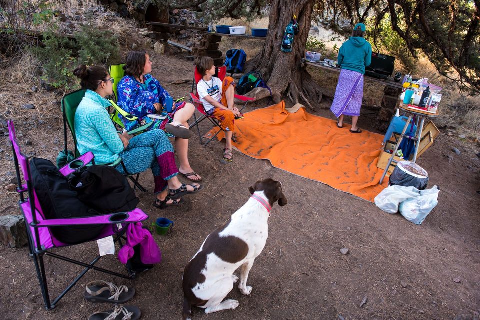 Kids and Dog Are Hungry. The youngsters wait patiently, droolingly, for dinner.