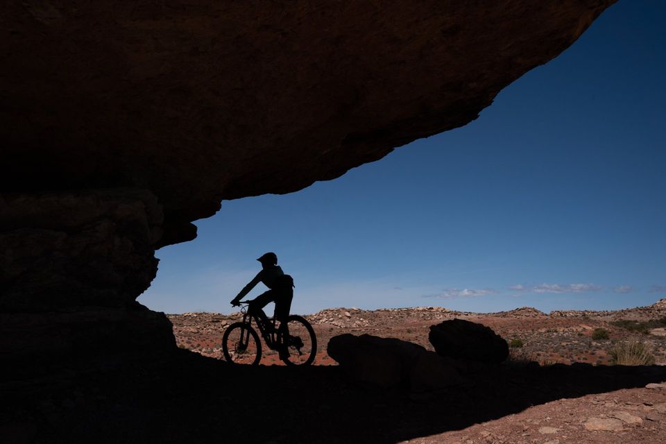 Overhang, Moab. Trail builders had a blast with overhanging rock north of Moab.