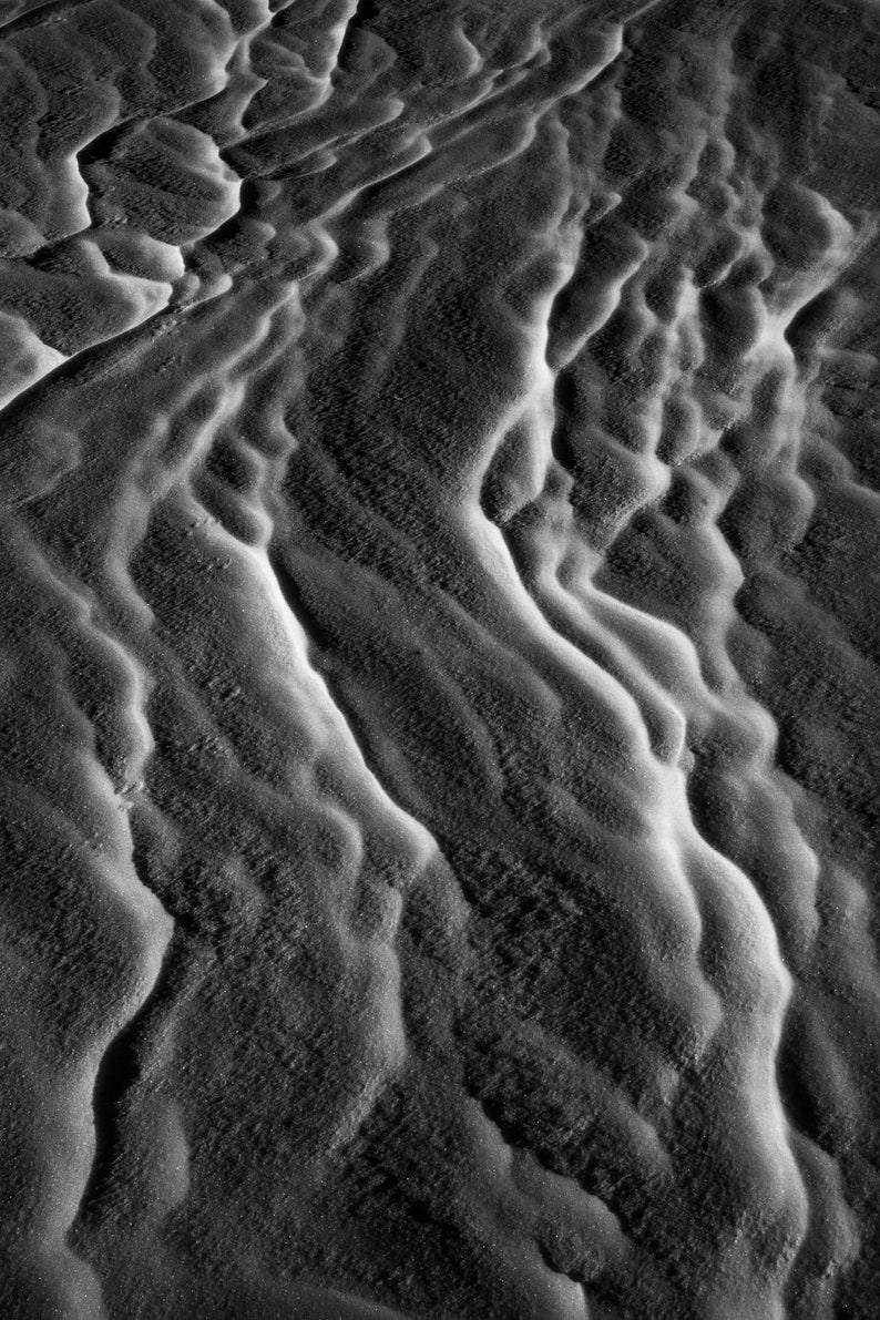 Sastrugi No. 1. Wind-carved ridges in the snow. Pairs with Sastrugi No. 2 as a diptych. Black and white.