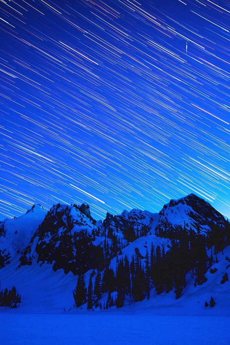Star Trails over Alice Lake, Idaho. Star trails over a frozen Alice Lake during a new moon on a winter camping trip, inside Idaho's Dark Sky Reserve.